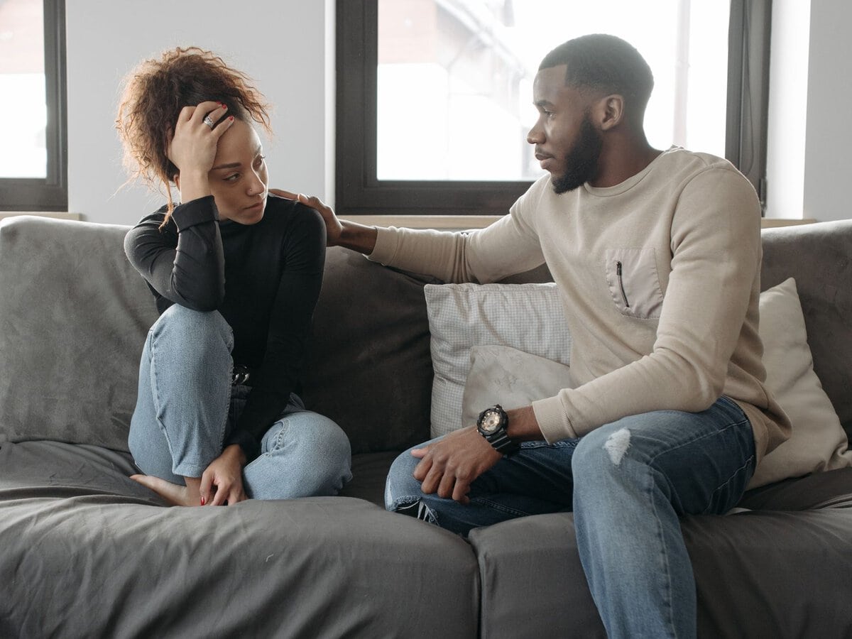 A partner offering support during a quiet conversation