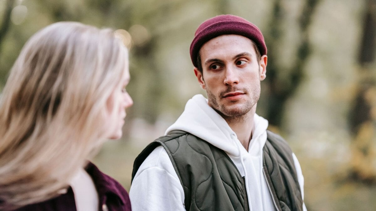 A couple having a conversation outdoors