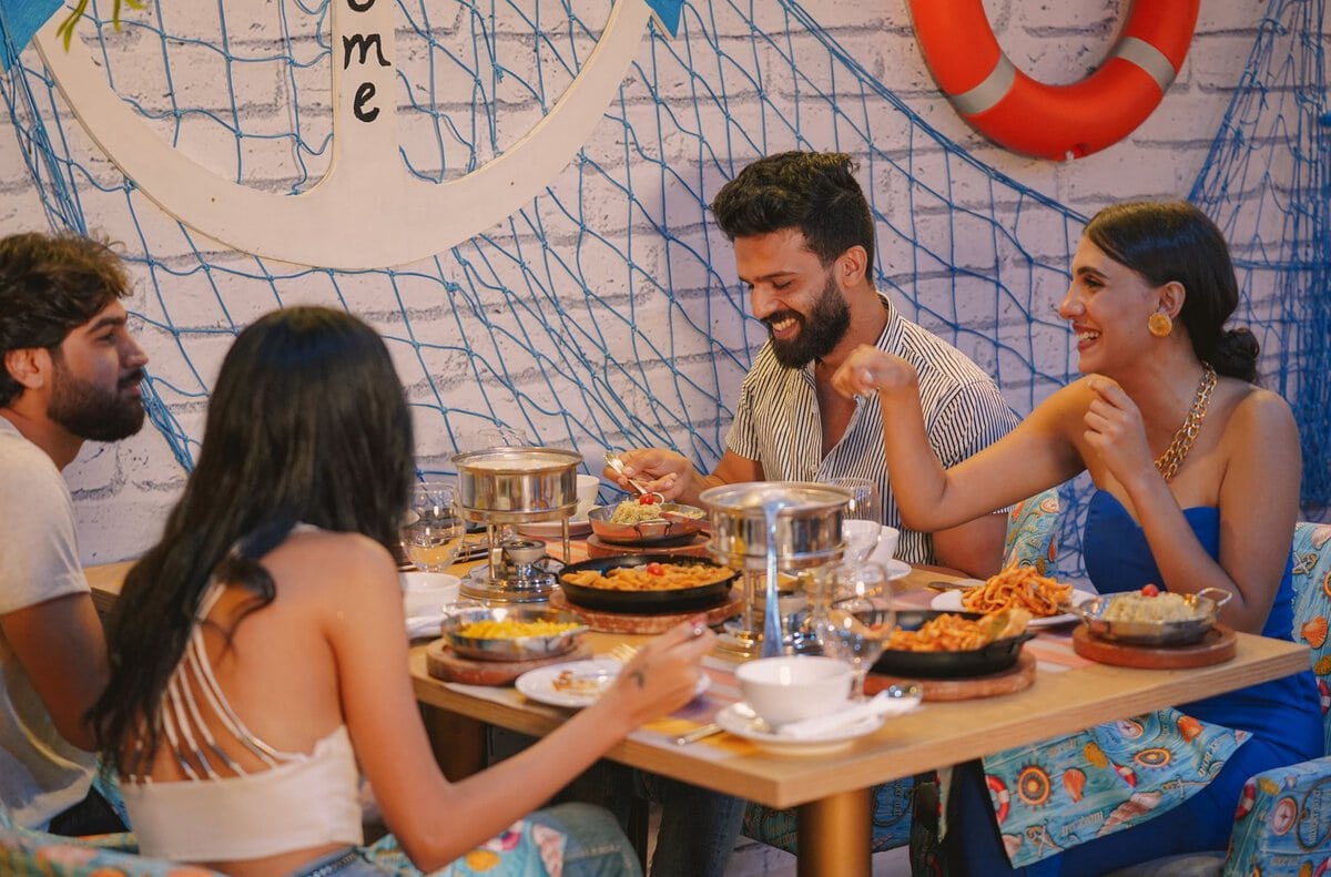 Friends talking around a restaurant table