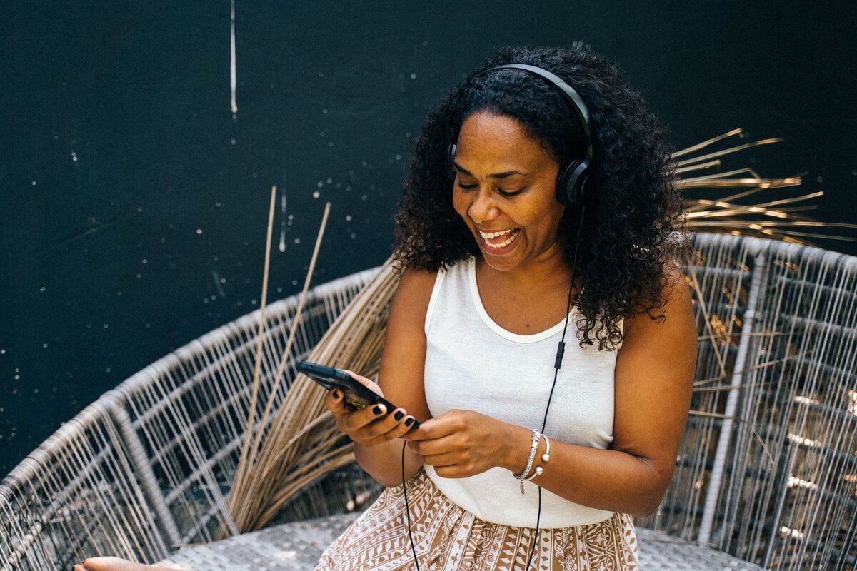 Woman enjoying music during a break outdoors