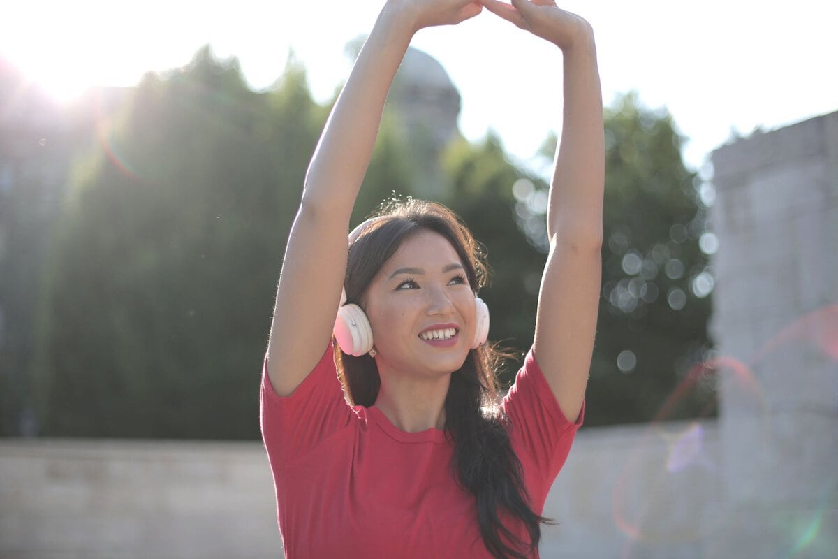 Woman stretching outside in the sunshine