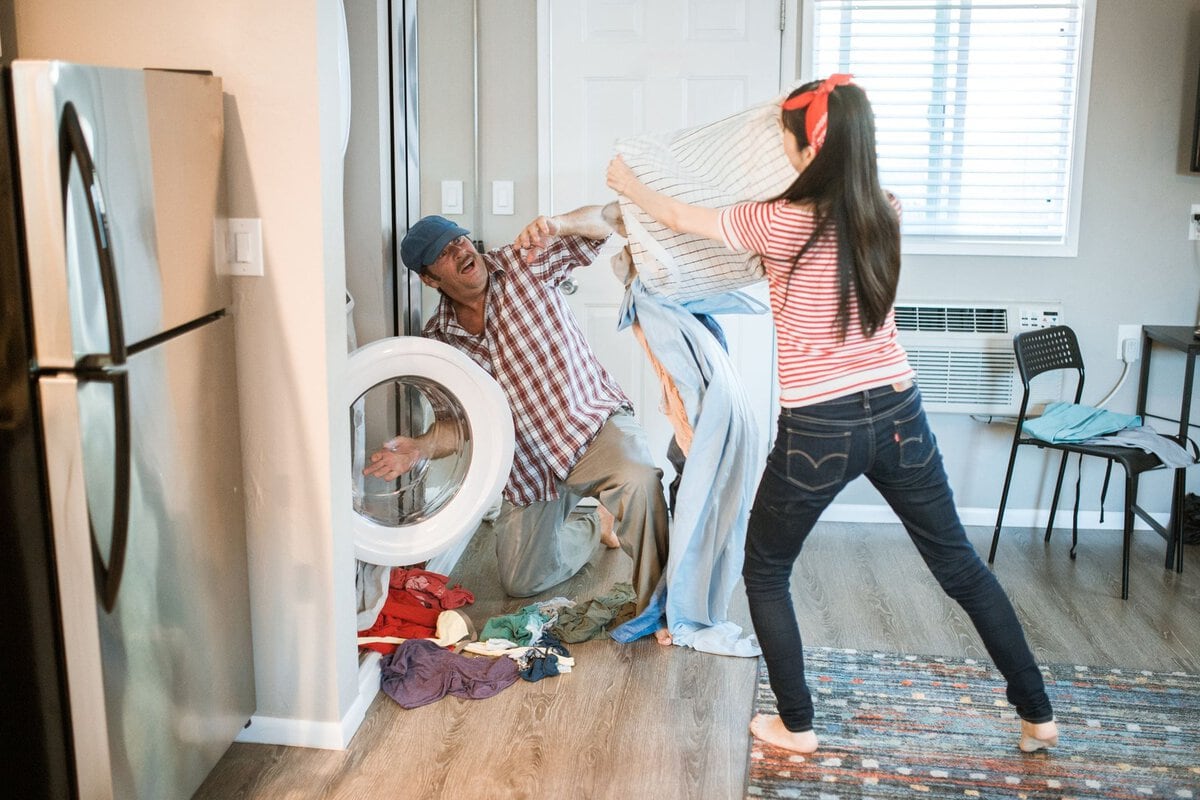 Two people sharing the laundry at home