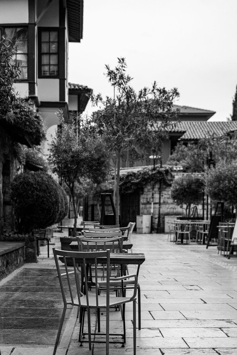 Empty cafe tables in a quiet courtyard
