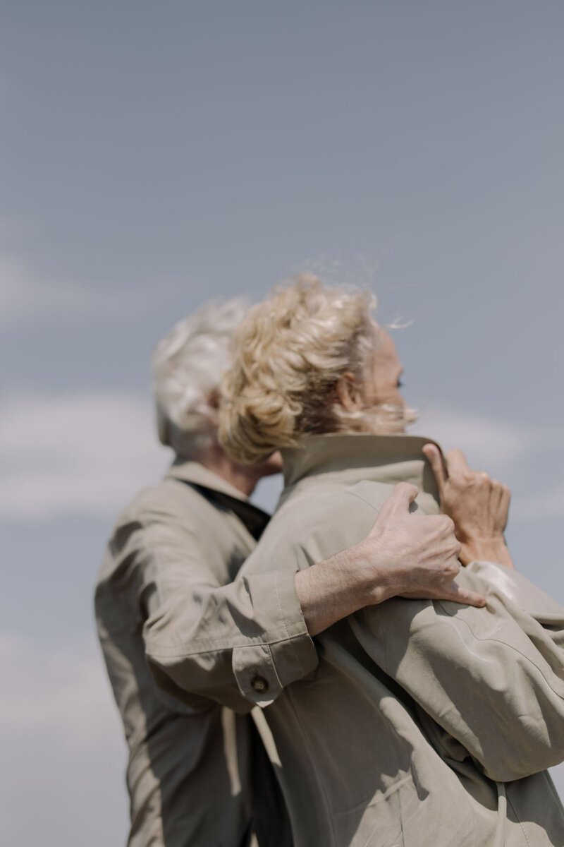 Older couple embracing outdoors
