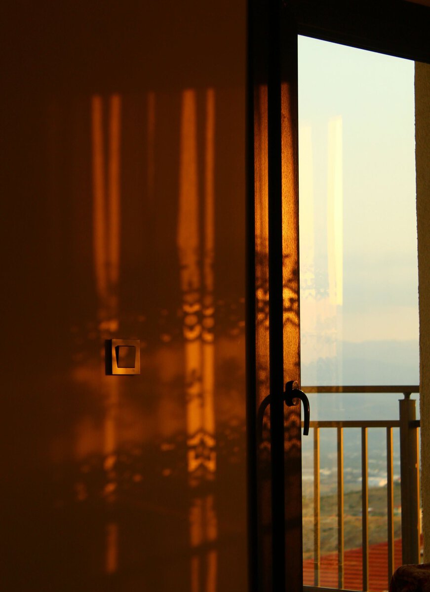 Sunlight entering a room through an open doorway