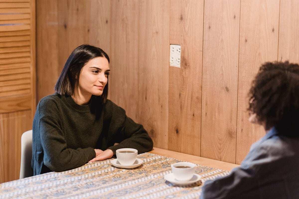 Two women talking over coffee