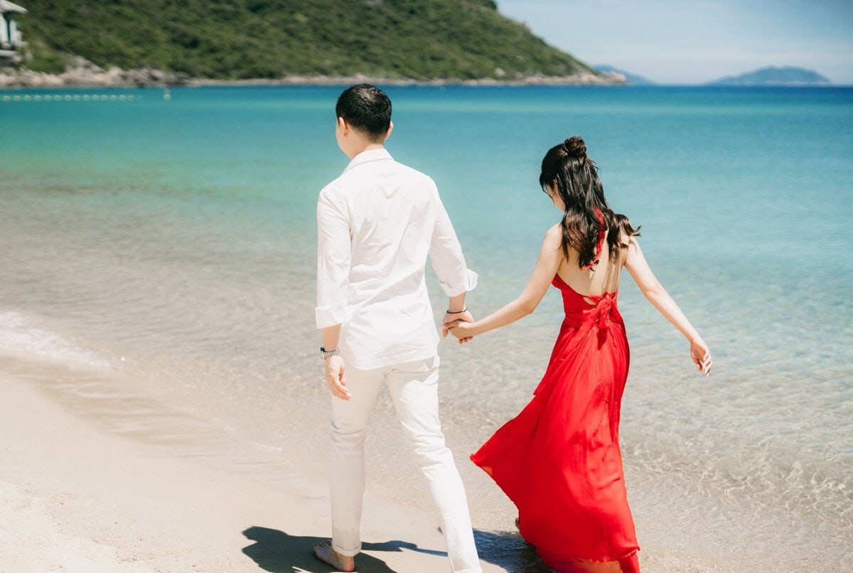 Couple holding hands on a beach