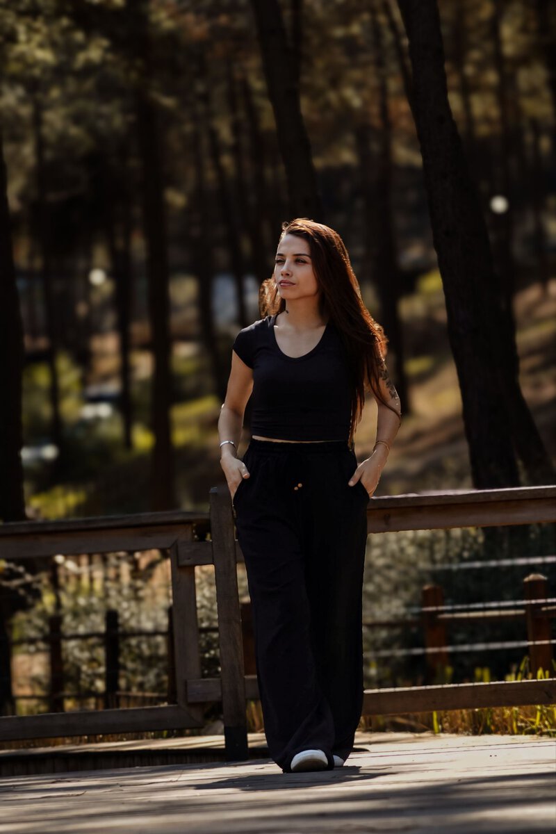 Woman walking along a woodland path